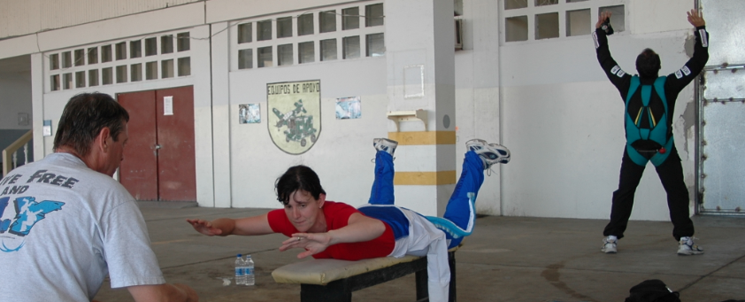 AFF student learning body position for basic bodyflight from Skydive University instructor